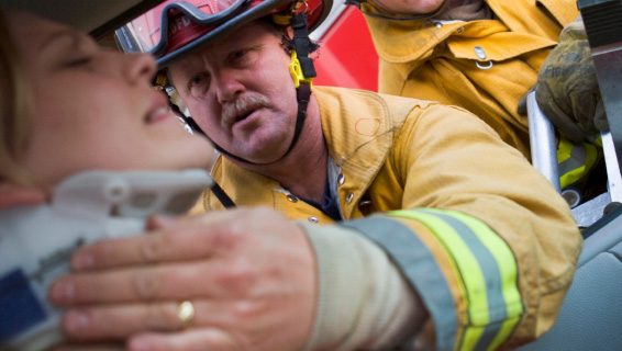 Blog - Roberi's Insurance Agency - Bodily Injury Liability Coverage Is Very Important - Photo of Firefighter putting neckbrace on female driver